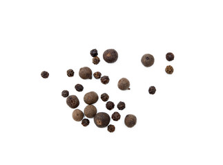 Scattered allspice and pepper isolated on white background