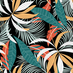 Tropical seamless pattern with colorful leaves and plants on a delicate dark background. Vector design. Jungle print. Floral background. Printing and textiles. Exotic tropics. Fresh design.