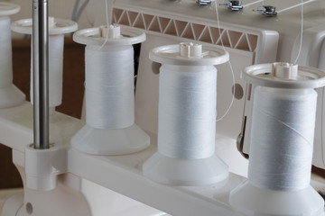 spools of thread close up, sewing supplies, place for text