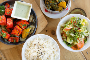 food, asian cuisine, culinary and cooking concept - various dishes on table of indian restaurant