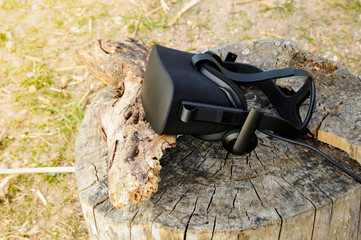 VR headset glasses outdoors in the forest, virtual technologies help people in realistic wildlife vision