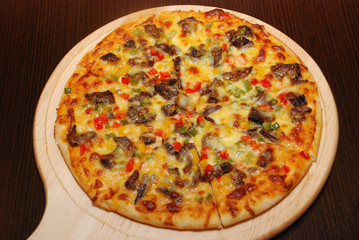 Pizza on the thin dough with cheese