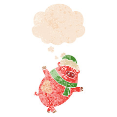 cartoon pig wearing christmas hat and thought bubble in retro textured style