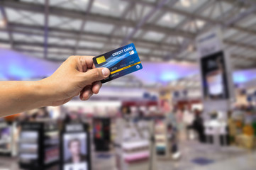Credit card payment transaction in shopping mall.  Moneyless online shopping using credit card buy all.