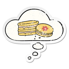 cartoon biscuit and thought bubble as a distressed worn sticker