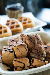 Toast topped with chocolate powder and chocolate sauce