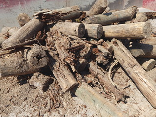 Pile of sandy timber as wooden building rubble after demolition