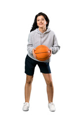 Young woman playing basketball
