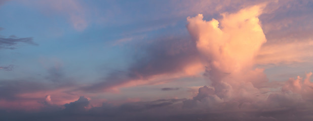 Panoramic View of a Dramatic Cloudscape during colorful sunrise.