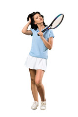 A full-length shot of a Young tennis player woman having doubts and with confuse face expression over isolated white background