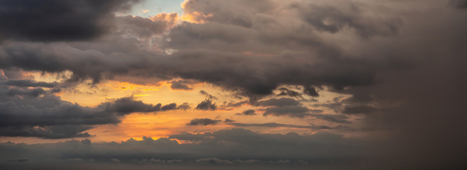 Dramatic Panoramic View of a cloudscape during a dark and colorful sunset. Taken over Havana, Cuba.