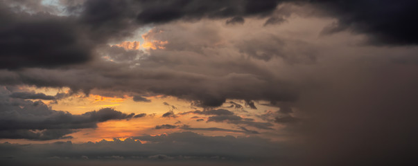 Dramatic Panoramic View of a cloudscape during a dark and colorful sunset. Taken over Havana, Cuba.