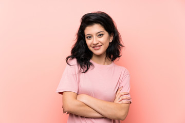 Fototapeta premium Young woman over isolated pink background laughing