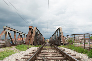 Fototapeta na wymiar Man walking on a rail bridge