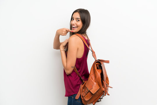 Young Woman Over Isolated White Background With Backpack