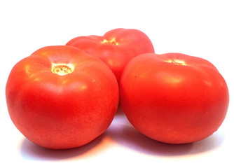 Red ripe tomatoes isolated on white background