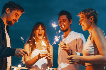 Friends enjoying a rooftop party