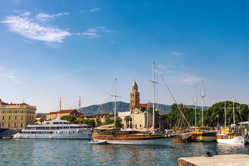Fototapeta na wymiar View of the Riva Harbor in Split with Cathedral's medieval tower, Split