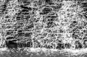 waterfall closeup from above. Black and white abstract