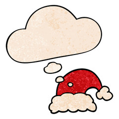 cartoon christmas hat and thought bubble in grunge texture pattern style