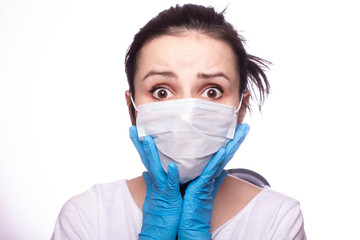 young woman in medical mask on her face, gloves on hands