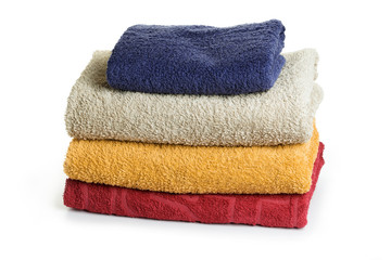 Stack of bath towels isolated on white