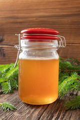 A jar of syrup made from young spruce tips