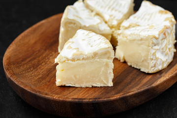 camembert soft cheese sliced. brie cheese. Italian, French cheese. macro shot.