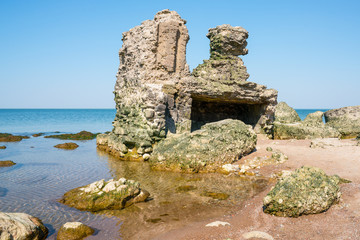 Ruins of bunkers on the beach of the Baltic sea in Liepaja, Latvia.