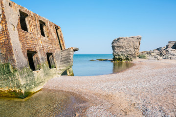 Ruins of bunkers on the beach of the Baltic sea in Liepaja, Latvia.