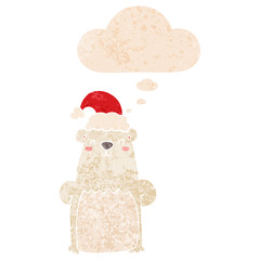 cartoon bear wearing christmas hat and thought bubble in retro textured style