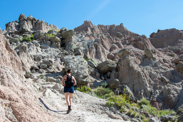 Fototapeta premium Woman Hiking up Mountain