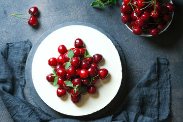 Delicious homemade cherry pie on a dark background top view copy space.