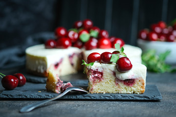 Delicious homemade cherry pie on a dark background.