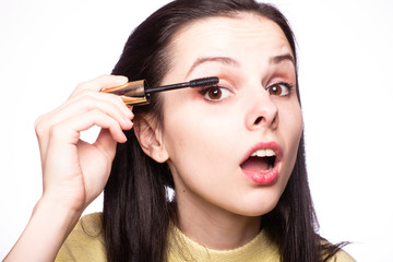 Obraz premium beautiful young girl close up portrait paints eyelashes