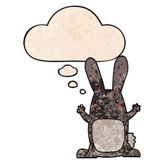 cartoon rabbit and thought bubble in grunge texture pattern style