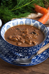 Goulash soup with pork and mushrooms.