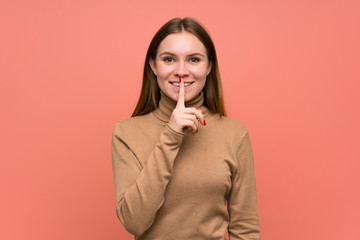 Young woman over colorful background doing silence gesture