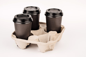 many random paper cups on white background.