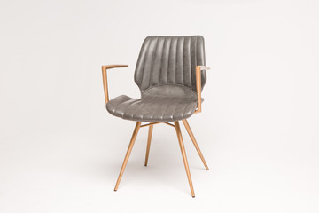 stylish grey armchair with wooden legs on a grey background