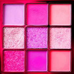 Colorful pallete of glitter eyes shadows close up. Top view. Make up product.