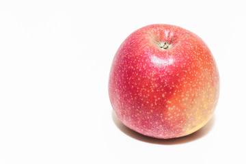 Red and juicy red apple on white background with copy space – Sweet and healthy fruit served as desert – Tasty snack with low calories suitable for diets