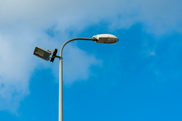 Lamp street lighting on the background of sky.