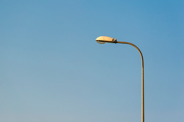 Lamp street lighting on the background of sky.