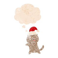 cute cartoon christmas cat and thought bubble in retro textured style