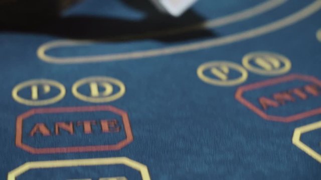 Woman croupier shuffling cards before playing poker close up. Casino dealer
