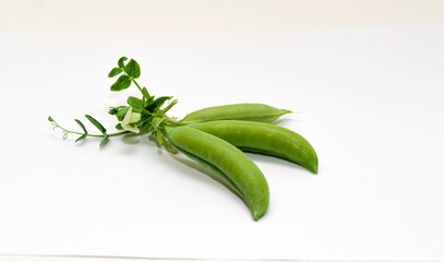 Green peas on a white background. Healthy food.