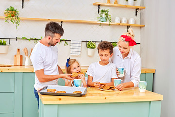 Family smiling having breakfast in kitchen at sunny day - Powered by Adobe