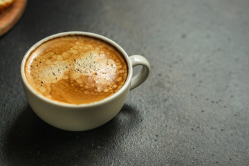 coffee freshly brewed in a white cup serving of beverage (coffee grain). food. top.copy save
