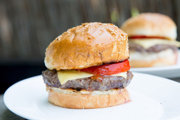 fresh tasty burger on wooden background